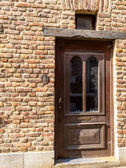 Old door with decoration of an abandoned house at Sint-Jozefsstraat in Tongeren, the oldest town of Belgium
