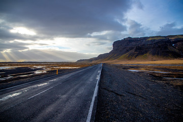 Desserted Icelandic road leading to the cliffs