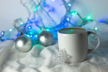 Christmas coffee cup with new year decorations on background.