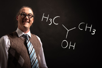 Professor presenting handdrawn chemical formula of Isopropylalcohol isopropanol 2-propanol