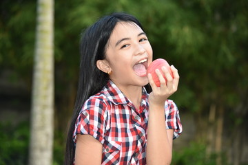 A Diverse Female Eating With Apples