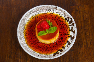 Panna cota with syrope and strawberry