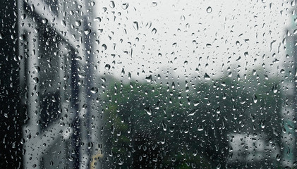 Drops of rain on a window pane, Torrential rain day..
