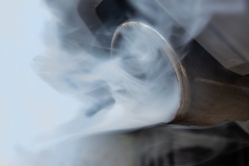 From a car exhaust flow polluting exhaust gases. Concept diesel and gasoline as environmental...