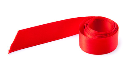 Shiny decorative rolled red ribbon close up on white background.......