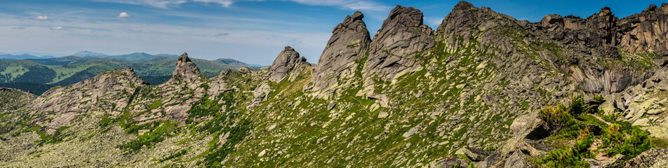 Gorgeous panoramic view on top of western Sayan mountain range during summer sunny day in Ergaki national park, Siberia, Russia