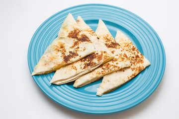 a cheese tortilla with a greens