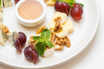 cheese plate with a honey and berries