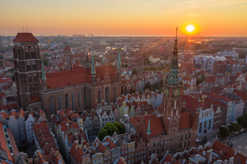 Obraz premium Gdansk is a city in Poland. Gdansk in the morning rays, the sun is reflected from the roofs of the old city.