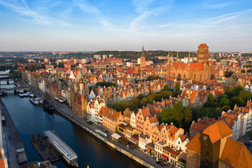 Fototapeta na wymiar Gdansk is a city in Poland. Gdansk in the morning rays, the sun is reflected from the roofs of the old city.