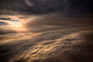 Clouds and sky as seen through window of an aircraft