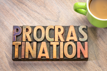 procrastination word abstract in wood type