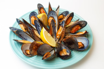 grilled mussels with a sauce on a white background