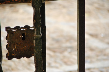 detail of a rusty lock on a gate