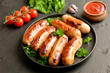 Barbecue sausage with fresh parsley on plate