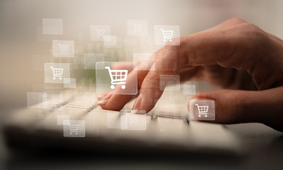 Business woman hand typing on keyboard with online shopping concept