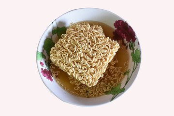 Instant noodles, cooked deliciously in a patterned bowl