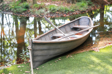 Lonely wooden old boat on the lake - Image