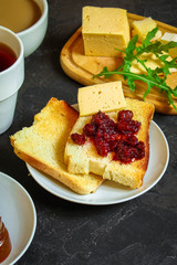 table with morning food, breakfast (tea, coffee, jam, toast, sandwich, cornflakes and more) menu concept. food background. copy save. Top view