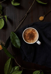 Top view of a cappuccino with leaves