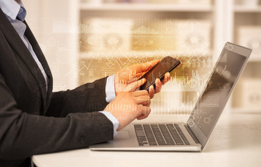 Business woman in homey environment using laptop with global financial report concept