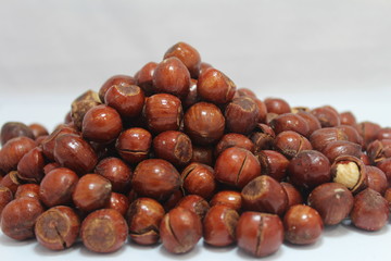 chestnuts in bowl on black background