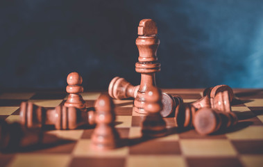 Chess board game bakground with figures, as a symbol of business strategy