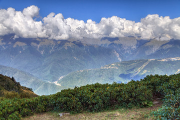 Scenic blue sky landscape of Caucasus Mountains at summer. Sochi, Russia, Krasnaya Polyana