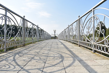 bridge with forged railing in the form of a road