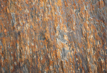 Abstract background of surface of a quarry stone with iron streaks