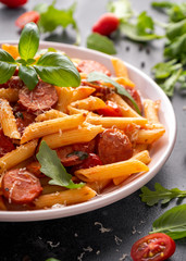 Sausage penne Pasta with tomato sauce and fresh herbs