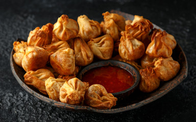 Chinese takeaway finger food Vegetable wontons with sweet chilli dip sauce