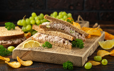 Healthy Tuna Sandwich with celery and onion on wooden board