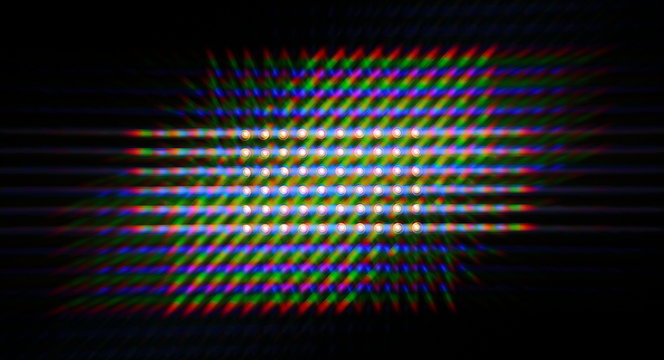 Photo of the diffraction pattern of LED array light, comprising a large number of diffraction orders obtained by the thin phase gratings