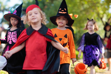 Fototapeta premium Kids trick or treat. Halloween fun for children.