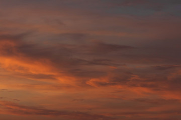 Fototapeta premium Colorful dramatic sky at sunset with pasted clouds