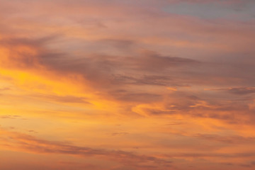 Obraz premium Colorful dramatic sky at sunset with pasted clouds