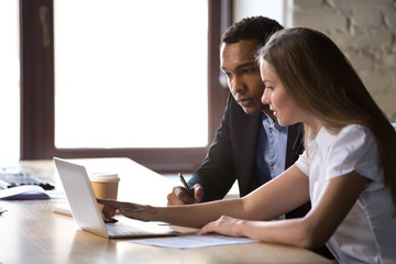 African American businessman and businesswoman working on project together