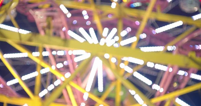 Abstract close up of carnival ride lit up at night