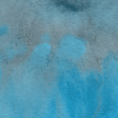 Obraz premium Blue watercolor winter texture with abstract washes and brush strokes on the white paper background.