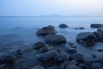 Fototapeta na wymiar stones in sea at sunset