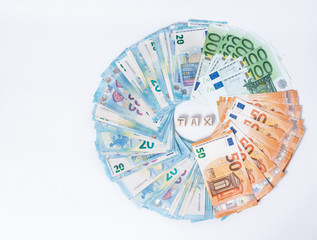 Concept tax and debt payment. Euro banknotes Laid out in a cicircle on white background. Money...