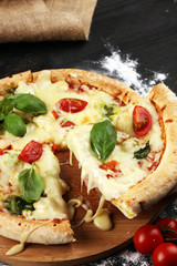 vegetarian italian Pizza with tomatoes, mozzarella cheese  and basil. Delicious italian pizza