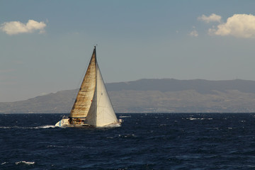 Fototapeta premium Sailing ship yachts with white sails in race the regatta in the open sea.