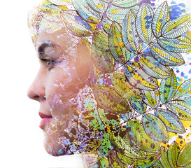 Paintography. Double exposure profile of a young natural beauty, with face and hair combined with colorful hand drawn leaves dissolving into the isolated white background