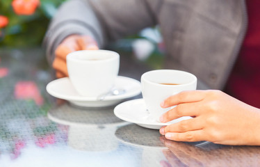 African american man and woman having coffee break together