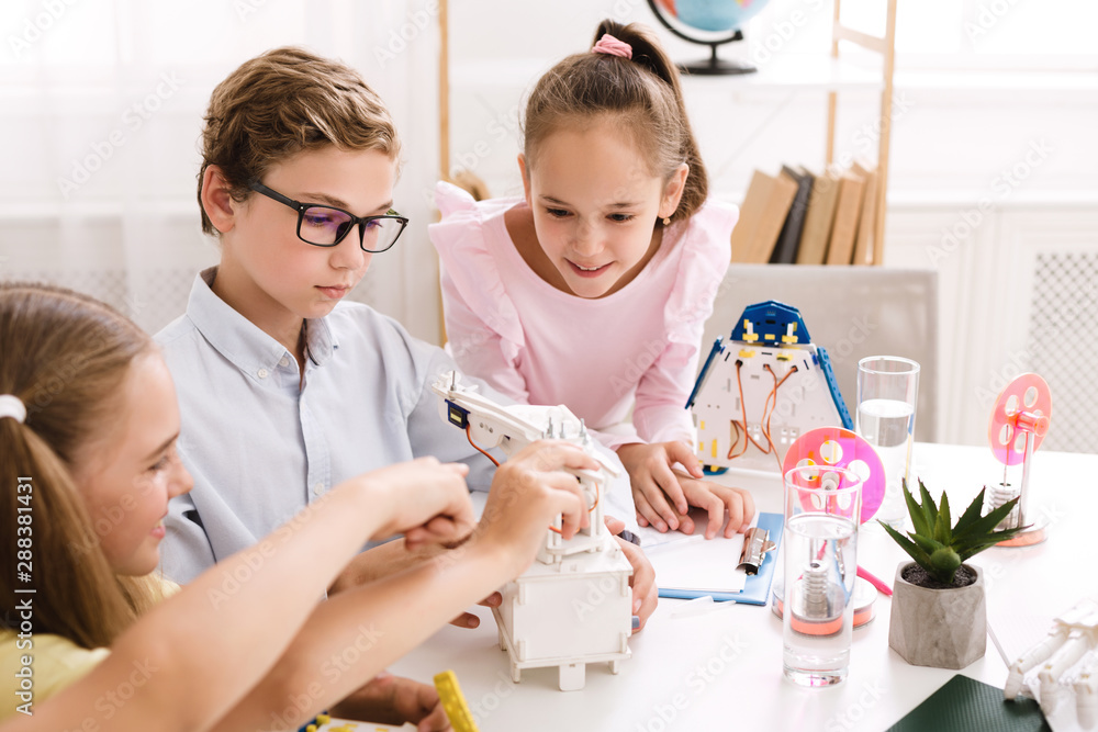 Poster stem education. children creating robots at school