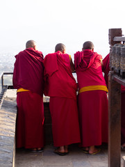 buddhist monks (candid) - looking out on balcony