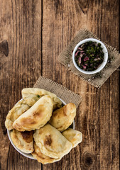 Some fresh made Empanadas (selective focus; close-up shot)