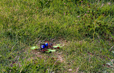 DIY drone taking off from the grassy field